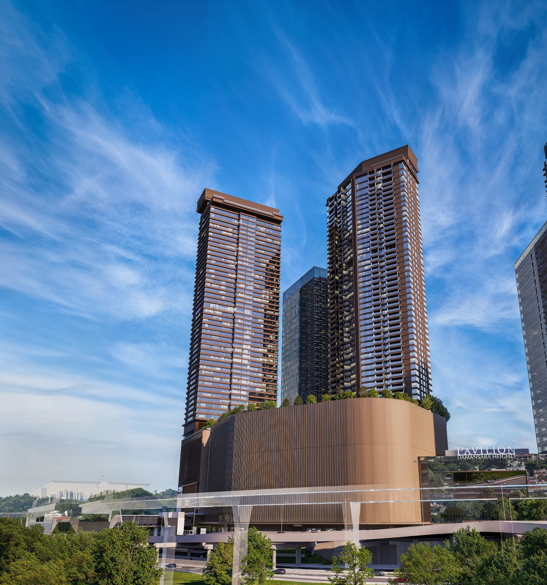 Royal Suites towers at Pavilion Damansara Heights beneath a clear blue sky